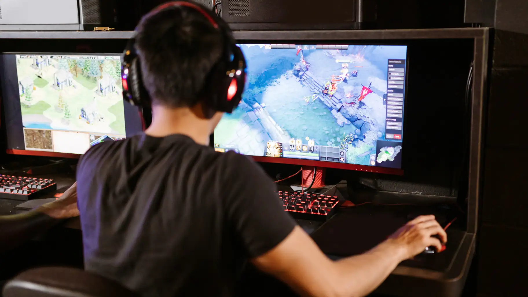A boy is playing online game on his desktop by using ethernet cable for stable and strong internet connection